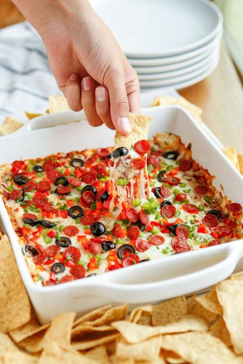 Pizza Dip Recipe -- this AH-MAZING hot pepperoni pizza dip is elevated to pizza supreme status with the addition of diced green & red bell peppers and black olives! SO yummy, it gets rave reviews every time I make it, so I recommend doubling the recipe… | unsophisticook.com Pizza Dips, Pizza Supreme, Game Day Dip, Super Bowl Appetizers, Pizza Dip Recipes, Pepperoni Pizza Dip, Hot Pizza, Pizza Dip, Watching Football