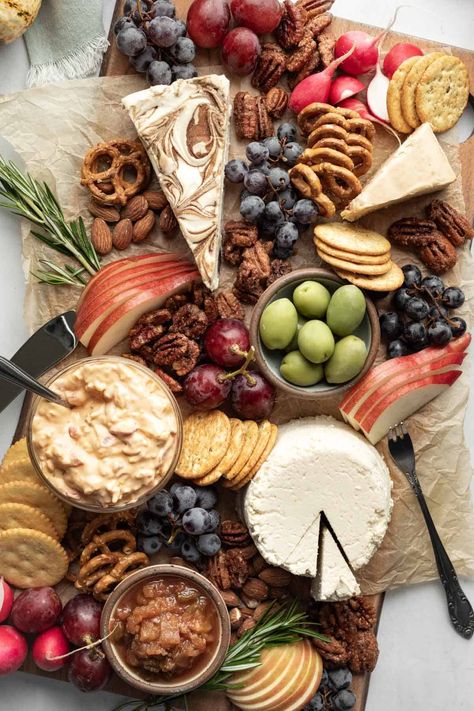 A beautiful vegan cheese board is perfect for parties and sure to wow your guests! From casual to fancy, vegan cheese plates (and even charcuterie boards) can be every bit as creative, unique, and impressive as their non-vegan counterparts! Read on to learn how to select the best vegan cheeses, what else you'll need to complete your cheese board, and how to pull it all together in no time. Vegan Cheese Board, Fancy Cheese Board, Vegan Charcuterie Board, Mini Food Appetizers, Cheeseboard Recipe, Vegan Cheese Boards, Best Thanksgiving Appetizers, Vegan Stuffed Mushrooms, Vegan Appetizers Recipes