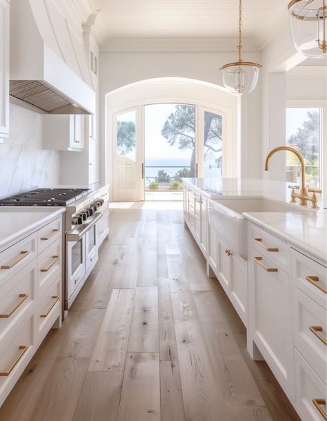 White Washed Wood Floors Kitchen, New White Kitchen, White Dream Kitchen Inspiration, Cream And Gold Kitchen Cabinets, Light Wood Floors White Cabinets, White And Gold Cabinets Kitchen, Range Hood With White Cabinets, Kitchens With Gold Accents, Kitchens With Gold Hardware