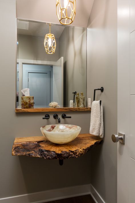 Another wonderful powder bathroom designed by Donna Kirsopp. This bathroom showcases a live edge counter with a vessel bowl. Live edge means what the outside of the tree looks like. The simple onyx bowl allows the wood to stand out. The overall design is simple allowing the showcase pieces to take the glory. Powder Bathroom, Sink Shelf, Rustic Bathroom Designs, Bathroom Top, Downstairs Bathroom, Design Remodel, Wood Bathroom, Live Edge Wood, Bathroom Renos