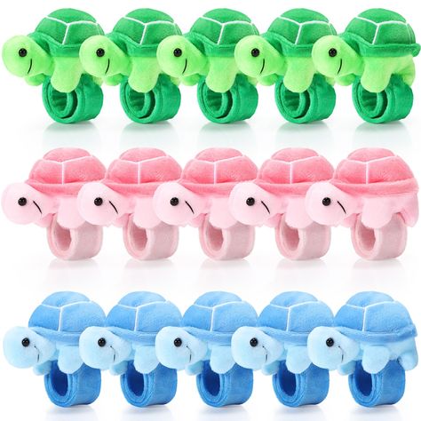 PRICES MAY VARY. Sufficient Quantity: you will receive 15 pieces stuffed turtle slap bracelet party favors in 3 different colors, 5 pieces for each color, which are exquisite and adorable, can easily get people's attention; You can wear them, share with others, or keep them as special bracelet collections Proper Size: the stuffed turtle animal slap bracelets measure about 8.66 inches/ 22 cm, fit comfortably on most wrists without slipping off, making them ideal accessories for most people who lo Turtle Slap, Sea Turtle Birthday Party, Bubble Guppies Decorations, Sea Party Favors, Cat Bday, Turtle Birthday Party, Stuffed Turtle, Goodie Bag Stuffers, Turtle Birthday Parties