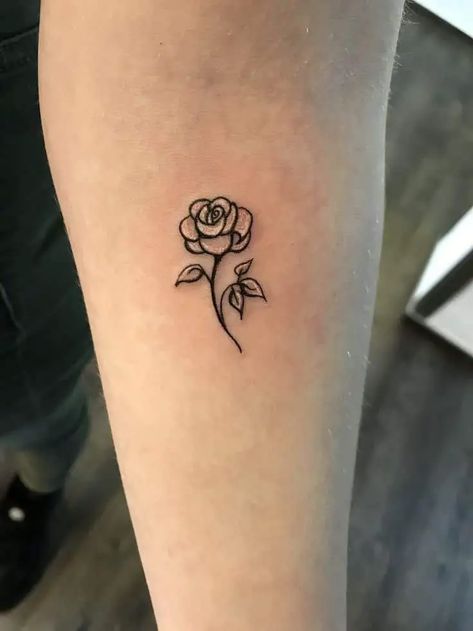 11 Unique Small Rose Tattoo Ideas for Females - That Grateful Soul Finger Rose Tattoos For Women, Rose Tattoo Beauty And The Beast, Simple Rose Outline Tattoo, Small Rose Tattoo Simple, Small Rose Tattoo On Wrist, Small Feminine Tattoos Classy, Small Rose Tattoo Ideas, Small Rose Hand Tattoo, Minimalist Rose Tattoo