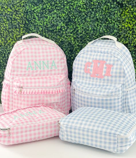 "Monogrammed Gingham Backpack and Lunchbox. The pink gingham bags feature a ruffle detail. Bags are a nylon material and can be easily wiped down. Backpacks are full size and perfect for back to school.  Straps are adjustable and have padding for extra comfort.  Exterior zipper pocket and two side pockets.  Font shown on pink bag is Lexi Font shown on blue bag is  Fishtail Applique Measurements: Backpack: 16 X 13 X 3.5\" Lunchbox: 12 X 10 X 3\" (please note the lunchbox is a larger size)" Gingham Bags For Travel And Back To School, Back To School Travel Bags In Gingham, Back To School Gingham Backpack For Everyday Use, Senior Year Backpack, Love Shack Fancy Backpack, Preppy Gingham School Bag, Gingham School Bag For Back To School, Gingham Backpack For Everyday Use, Back To School Gingham Travel Bags