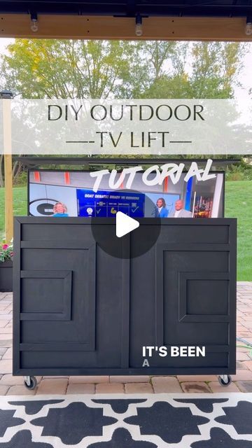 Nneka Mosley | DIY & Design + Lifestyle | PA on Instagram: "SAVE THIS POST! (Update- my building plan for this is available in my bio!). It’s been a year since I made this tv lift for my husband and we’ve definitely gotten great use out of it! We purchased a grill cover and used that to cover it when not in use. We also brought in inside the house when it got really cold then brought it back out in spring. So today I’m running this back because now is the perfect time to make one…just in time for football season. This is really a very simple build. It’s literally just a basic box..no fancy cuts although you can definitely add some miter cuts for a cleaner look. The magic is in the tv lift mechanism that you buy, assemble then add to the box. I used one of the mid range mechanisms (wi Outdoor Tv Case, Outdoor Tv Box, Tv Cabinet Diy, Outdoor Tv Setup, Outdoor Tv Stand, Outdoor Tv Mount, Patio Tv, Tv Lift Mechanism, Outdoor Tv Enclosure