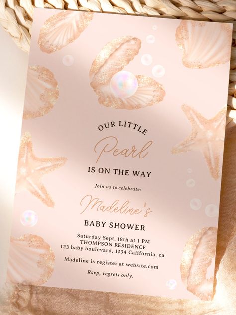 Cute summer ocean little pearl baby shower invitation Our little pearl is on the way! Announce your upcoming baby shower with hand painted invitations, featuring cute and charming illustration of seashell, oyster, starfish in beige and faux gold glitter with an iridescent pearl and water bubbles. The modern brush script adds a touch of elegance to these unique invitations that are perfect for any summer and beach-ocean celebration #babyshower #babyshowersgifts #babyshowercards #babyshowerparty Our Little Pearl Is On The Way, Pearl Baby Shower Theme, Oyster Baby Shower Theme, A Little Pearl Is On The Way, Beachy Baby Shower Ideas, Ocean Baby Shower Ideas, Pearl Baby Shower Ideas, Beach Themed Baby Shower Ideas, Seashell Invitation