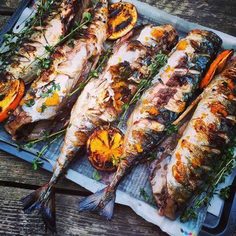 Mackerel is just made for BBQ and how about these lovely grilled delights? 🐟 🐟 📷 @lockdown_bbq_king BBQ # 49 #100bbqsofsummer  Whole mackerel with sea salt, orange and thyme.  Fresh mackerel is made for the bbq and it's definitely one of my favourites. I used to get hung up on trying to cook the whole fish without bits of skin breaking away and some of the meat flaking off but it doesn't bother me anymore. I like it the way it is. Fish Bbq Grilled, Bbq Fish, Smoked Mackerel, Whole Fish, Bbq King, I Want Food, Smoked Fish, How To Cook Fish, Cocktail Desserts