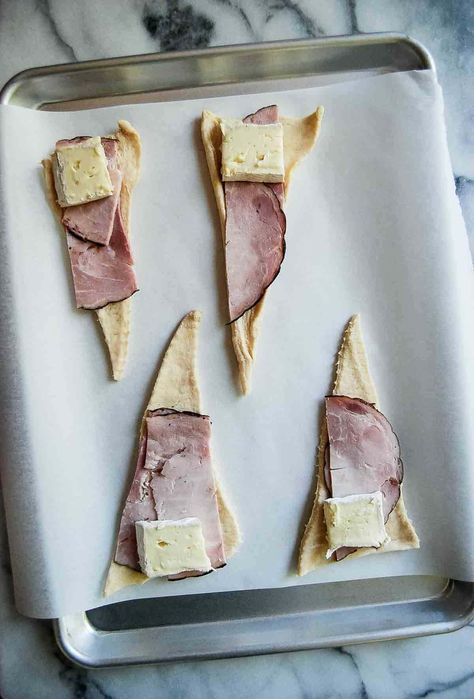 " These Ham and Cheese Crescent Roll Sandwiches are a must-try for busy weeknights or as a quick holiday app! Made with Pillsbury crescent dough, deli ham, and brie cheese, these roll-ups are easy, baked to perfection, and taste fancy without the fuss. Serve them hot from the oven or try them in the air fryer for a crisp twist. Perfect for breakfast, brunch, or an appetizer, these roll-ups are a crowd-pleaser with simple ingredients. Find this and other easy meal ideas at ... Ham And Cheese Crescent Rolls, Ham And Cheese Crescent, Roll Sandwiches, Cheese Crescent Roll Recipes, Homemade Crescent Rolls, Rolled Sandwiches, Pillsbury Crescent, Cheese Crescent Rolls, Cheese Buns