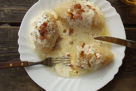 Potato-meat dumplings known as zeppelins or cepelinai are a traditional Lithuanian dish. Most often they are served with bacon gravy and sour cream. Cepelinai Recipe, Meat Dumplings Recipe, Lithuania Food, Bacon Gravy, Fried Cheese Curds, Meat Dumplings, Bacon Sauce, Lithuanian Recipes, Potato Pudding