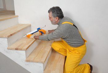 How to Install Wood Stair Treads Without Showing Nail Holes | Home Guides | SF Gate Stairs Treads And Risers, Wood Stair Treads, Hardwood Stairs, Treads And Risers, House Shifting, Silicone Caulk, Staircase Makeover, Concrete Stairs, Basement Stairs