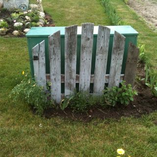 Cover up the ugly green utilities box . Disguising Utility Boxes, Utility Covers, Electric Box, Green Box, Home Landscaping, Garden Yard Ideas, Privacy Fence, Yard Design, Propane Tank