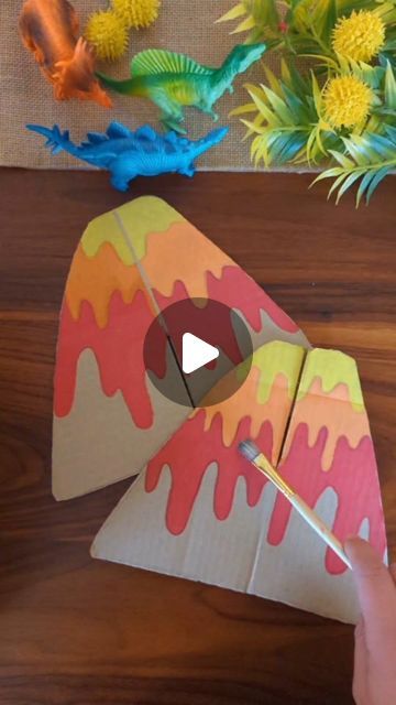 Studio Rosie on Instagram: "3D Cardboard Volcano! 🌋  Happy Valentine's Day! I made this volcano, with a special Valentine's Day note, to go with a dinosaur sensory bin for Rosie and Mae!  I cut out a volcano shape with two pieces of cardboard, one has a cut halfway from the top and the other a cut halfway from the bottom. They slide together into a 3D volcano!   I'll post pictures of the sensory bin tomorrow 🦕  #recycleandplay @recycleandplay #recyclemeplay @recyclemeplay #littlesplayshare #funbudgetplay #craftcreateandmake #create_play_inspire #diyvalentine #valentinesdaygift #valentinesday #cardboardcrafts #kidscraft #inspireuswithyourplay #fantasyhasreallynolimits #makecreateplay #savecraftplay #valentinescardboardplay" Cardboard Volcano, Volcano Project Ideas, Volcano Craft For Kids, Volcano Crafts, Volcano Diy, Volcano Project For Kids, Diy Volcano Projects, Volcano Craft, Diy Volcano