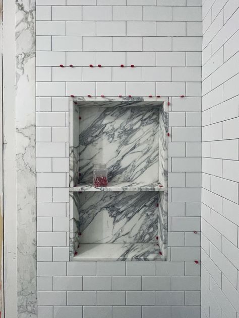 Work in progress, calacatta marble shower niche surrounded by 4x6 subway tiles Marble Shampoo Niche, Marble Shower Shelf, Marble Shower Surround, Marble And Subway Tile Bathroom, Shower Niche Marble, Quartz Shower Niche, Long Shower Niche, Double Shower Niche, Large Shower Niche