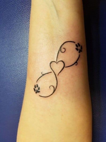 160+ Infinity Tattoo With Names, Dates, Symbols And More (For Women) Tatoo Dog, A Small Tattoo, Infinity Tattoo Designs, Dog Memorial Tattoos, Pawprint Tattoo, Small Heart Tattoos, Wrist Tattoos For Guys, Paw Tattoo, Cat Tattoos