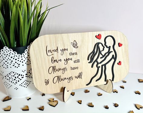 This beautifully crafted oak veneered wooden shelf sign/plaque will make the perfect romantic gift for Valentines Day, Anniversary or even birthday for your wife, husband, boyfriend or girlfriend. The sign is made from oak veneer plywood and has been laser engraved with the quote “Loved you then, Love you still, Always have Always will” andRead more ⟶ The post Couple in Love Wooden Line Art Plaque appeared first on The Market Co. Laser Valentine, Engraved Valentines Gifts, Lasercut Gift, Valentine Wood Crafts, Wooden Feather, Veneer Plywood, Laser Projects, Laser Engraved Ideas, Gift For Valentines Day