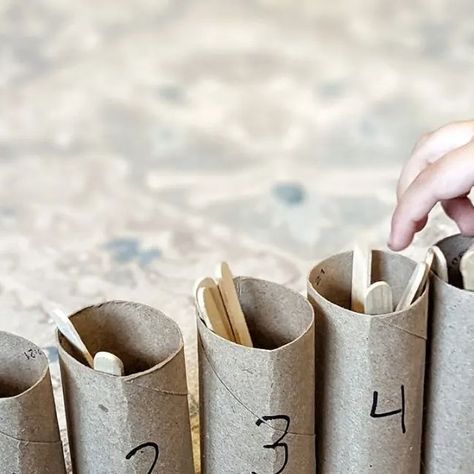 Amy on Instagram: "Here is a great way to practice counting and number identification with your preschooler! I used hot glue to secure toilet paper rolls to a strip of cardboard and then labeled them with numbers 1-5. You can use any numbers you want your child to practice. Then, I gave my son craft sticks and told him to count the craft sticks and put the amount written on the tube in each one. #preschoolmath #homeschoolpreschool #funforpreschoolers #toddlerlearning #hometaught #learnathome" Number Bonds To 10, Toilet Roll Craft, Number Identification, Number Bonds, Craft Sticks, Toilet Paper Rolls, Number Activities, Counting Activities, Paper Rolls