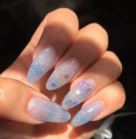 Nail Art On Glitter Base, Cute Blue Sparkly Nails, Clear Kawaii Nails, Clear Blue Glitter Nails, Blue Sheer Nails, Light Blue Clear Nails, Blue Clear Acrylic Nails, Glitter Light Blue Nails, Light Blue Sparkly Acrylic Nails