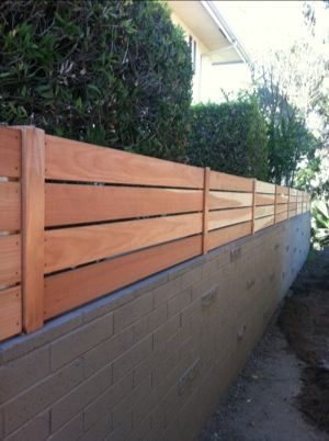 redwood fence block wall Wood Fence On Top Of Cinder Block Wall, Cement Block Fence Ideas, Block Wall Extension Ideas, Concrete Privacy Fence, Privacy Fence On Top Of Block Wall, Cinder Block Privacy Wall, Backyard Cinder Block Wall Makeover, Block Wall Covering Ideas Outdoor, Cinder Block And Wood Fence