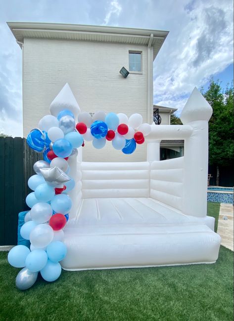 Balloon garland + white castle bounce house Castle Bounce House, White Castle, Bounce House, Balloon Garland, Fourth Of July, Baby Mobile, Balloons, Castle, White