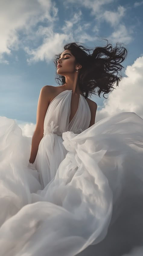 Embrace celestial elegance in a Libra-inspired floating silk gown, channeling an air goddess against a dreamy cloud backdrop for an ethereal editorial wonder. Big Dress Photoshoot, Allegorical Paintings, Ball Gown Photoshoot, Big Gowns, Flowy Dress Outfit, Ethereal Editorial, Ethereal Photoshoot, Air Goddess, Cloud Backdrop