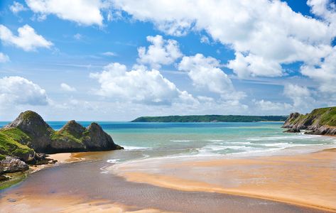 The Welsh beach at Three Cliffs Bay, on the Gower Peninsula, is wild and windswept. Welsh Beaches, Wales Beach, Gower Peninsula, Northern Island, British Beaches, Devon Coast, Uk Beaches, Beach Canvas Wall Art, South West Coast Path