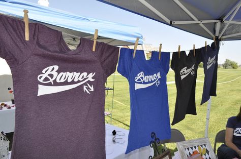 Hanging shirts for display!                              … How To Display Shirts For Sale Craft Fairs, Vendor Shirt Display, Tshirt Booth Display Ideas Vendor, Tshirt Display Ideas Booth, Craft Fair Booth Display Ideas, Fair Booth Display Ideas, Clothing Booth Display, Vendor Table Display, Booth Display Ideas