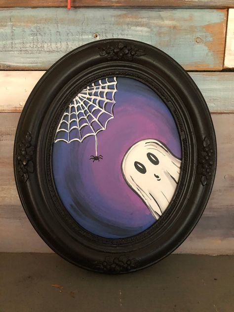 This spooky, up-cycled vintage frame is haunted! With the spirit of an adorable ghost. Haunted painted and one of a kind. Oval frame without glass is approximately 13x11 inches. Painting On Glass Frame, Holiday Paintings On Canvas, Halloween Canvases, Disk Art, Ghost Paintings, Creative Doodles, Creepy Paintings, Halloween Canvas Art, Ghost Painting