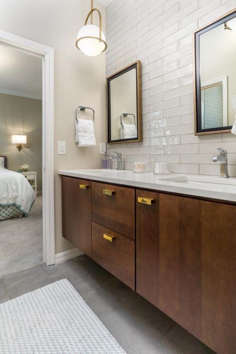 Sophisticated Contemporary Bathroom | HGTV White Tile Bathroom, Vanity Grey, Grey Floors, Gray Tile Backsplash, Beach Style Bathroom, Clear Glass Chandelier, Grey Backsplash, Black Granite Countertops, Half Walls