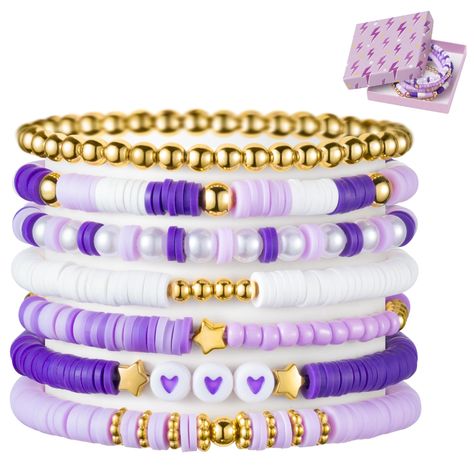 PRICES MAY VARY. Purple Stackable Bracelets: Elevate your accessory with our purple heishi bead bracelet set, featuring seven unique pieces that add flair to any ensemble. Five bracelets boast a captivating blend of gold-plated beads, purple and white clay beads, while one alternates between pearl beads and purple clay beads. The final piece features a string of gold-plated round beads, completing this stunning collection. Crafted with Care: Our purple friendship bracelets are carefully strung f Stitch Beaded Bracelet, Purple Bracelet Clay Beads, Friends Themed Bracelets, Cute Clay Bead Ideas, Clay Bracelets Ideas Aesthetic, Bracelet Ideas To Make, Flat Bead Bracelet Ideas, Bead Brackets, Preppy Clay Bead Bracelets