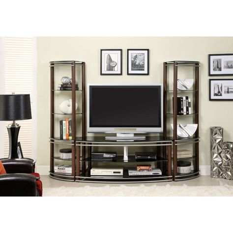 Organize your media center with this contemporary entertainment center, featuring a curved TV stand and matching tiers with black tempered glass shelves supported by a metal and wood frame for extra support. With plenty of open shelving and cabinetry to showcase decor and keep media consoles, this entertainment center is the perfect addition to a more casual family entertainment room, adding a strikingly handsome mixed material design. Furniture Tv Unit, Metal Entertainment Center, Modern Media Center, Contemporary Entertainment Center, Tv Stand Set, Wood Entertainment Center, Silver Furniture, Entertaining Space, Entertainment Stand