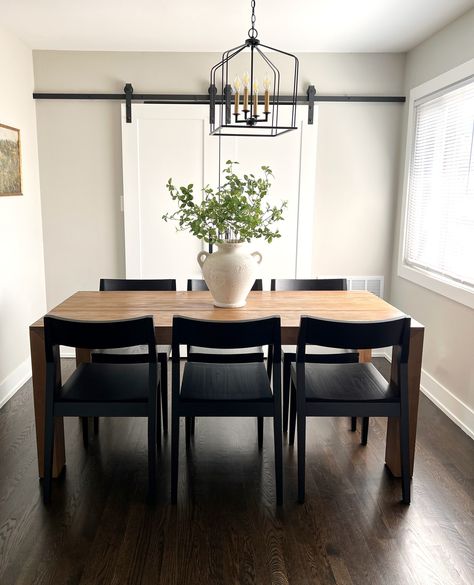 We love the way our solid wood tables look in natural lighting!⁠ .⁠ This is our Modern Dining Table in Pecan paired with our Black Solid Wood Dining Chairs. The natural light and minimalist design bring out the beautiful details of the wood to create an organic look in your space. Click the link in our bio to check out all of our dining tables, benches, chairs, and sets! ⁠ .⁠ #plankandbeam #diningroominspo #diningset #homedetails #homedecor #cottagecore #minimalistaesthetic Dining Table Black Wood, Dining Accent Chairs, Pecan Dining Table, Dining Room Black And Wood, Black Dining Room Aesthetic, Black And Brown Kitchen Table, Black Table With Wood Chairs, Black Kitchen Table Decor Ideas, Brown Dining Table Black Chairs