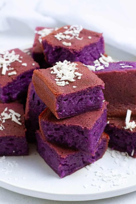 Ube mochi squares with coconut flake topping. Squares With Coconut, Ube Mochi Recipe, Peanut Butter Mochi, Ube Mochi, Rice Flour Recipes, Coconut Milk Uses, Hawaiian Desserts, Ube Recipes, Gluten Free Dairy Free Dessert