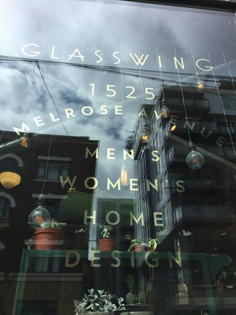 Gold lettering on display window Gold Window Lettering, Window Fonts Store Fronts, Gold Foil Window Signage, Black And Gold Signage Store Fronts, Glass Gilding Sign, Gold Lettering Signage, Gold Window, Glass Store, Retail Windows