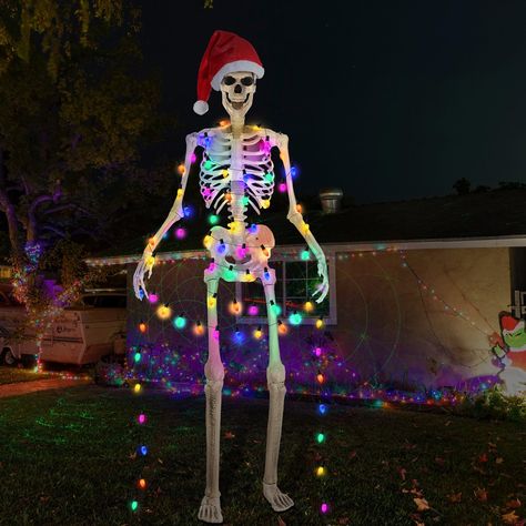 PRICES MAY VARY. Skeleton Santa Costume Accessory: enjoy the holiday atmosphere with these 12 ft skeleton Santa costume accessories, including a Santa hat and a string of C9 colored lights; They make your Skeleton decorations more festive in Halloween and Christmas Ideal Size and Quality Material: this Christmas hat is about 23 inches in width and 34 inches in height, crafted with polyester imitation wool, assures lasting durability and comfort; The colorful Christmas lights are UL certification 12 Ft Skeleton Christmas Ideas, 12ft Skeleton Christmas, Skeleton Christmas Decorations, 12 Ft Skeleton Christmas, Christmas Skeleton Decorations, 12 Foot Skeleton Christmas, Creepy Christmas Decorations, 12 Ft Skeleton Ideas, Skelly Ideas