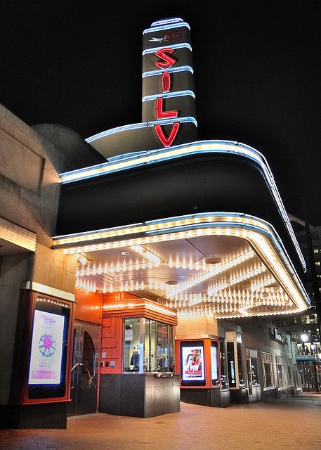 Modern Movie Theater, Theatre Facade, Theatre Entrance, Marquee Signage, Theatre Marquee, Cyberpunk Movies, Fantastic Architecture, Art Deco Theater, Cinema Theater