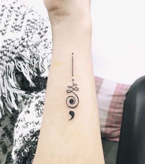 an unalome buddist tattoo with a semicolon by @natattoostudio  - Empowering Semicolon Tattoos To Carry On The Hope Of Life - OurMindfulLife.com Semicolon Wrist Tattoo, Colon Tattoo, Small Arrow Tattoos, Buddhist Tattoo, Semi Colon, Health Tattoo, Petit Tattoo, Unalome Tattoo, Omerta Tattoo