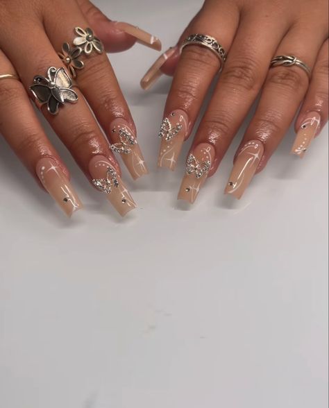 Nails Acrylic Crystal, Nude Nails With Butterflies, Nude Nails With Charms, Butterfly Gem Nails, Nails With Butterfly Charms, Silver Butterfly Nails, Butterfly Charm Nails, Gold Butterfly Nails, Butterflies Nails Acrylics