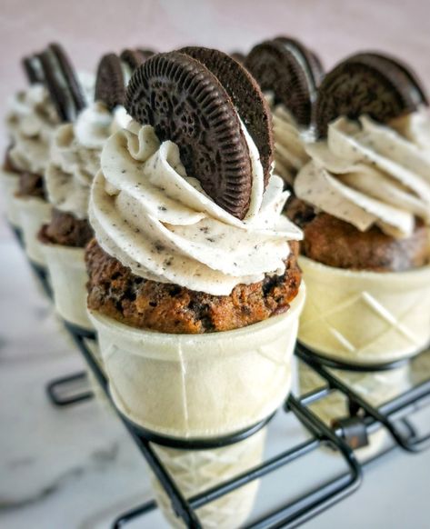 These cookies  cream cupcake cones are stuffed with oreos and topped with cookies  cream frosting. Baked in waffle cones. Can be made gluten free. Cupcake Cones Recipe, Oreo Muffins, Cupcake Ice Cream Cones, Waffle Cone Recipe, Cookies And Cream Frosting, Cone Dessert, Ice Cream Waffle Cone, Ice Cream Cone Cupcakes, Ice Cream Party Theme