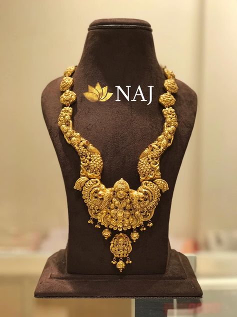 Bridal Jewellery - Traditional Lakshmidevi Haaram in deep nakshi work...Available Only @ NAJ Call or WhatsApp @ 9032041323 or email to mynaj@najindia.com... Available Only @ Naj Jewellery, Nellore.#TANAUSA, #TeluguUSA Gold Aram Designs Latest, Naj Jewellery, Jewellery Traditional, Haram Designs, Necklace Traditional, Gold Temple Jewellery, Antique Gold Jewelry Indian, Gold Necklace Indian, Gold Chain Design