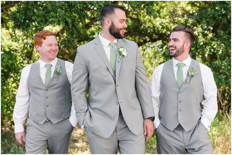 Wedding party in woods wearing gray suit and vests and sage green tie and champagne dress with sage green bridesmaid dresses | Sage Green and Gray Summer Wedding at Oak Hills | Jessie and Dallin Photography #utahwedding #utahweddings #utahweddingvenue #utahweddingvenues #utahweddingvendors #utahweddingphotography #utahbride #utahbrideandgroom #oakhills #mountainwedding #utahweddingphotographer #sagegreen #candidwedding #rockymountainwedding #weddingday #weddingparty #bridesmaids #groomsmen Groomsmen Attire Eucalyptus, Sage Wedding Mens Suit, Grey And Sage Wedding Suit, Grey Suit Sage Tie Wedding, Sage And Lavender Groomsmen, Grey And Sage Green Groomsmen Attire, Sage Ties Groomsmen, Groom And Groomsmen Attire Sage Green, Grey And Green Groomsmen Attire