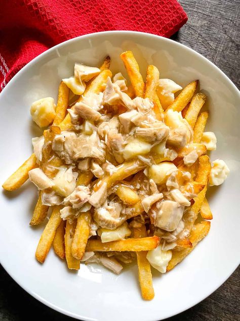 If you’ve got leftover turkey and gravy in the fridge from Thanksgiving, make a quick turkey poutine. How to Make Poutine with Leftover Turkey and Gravy Use frozen French fries. Regular or sweet potato French fries taste great with turkey poutine. Since this poutine uses leftovers, I like to use my air fryer to make...Read More Turkey Poutine, Sweet Potato French Fries, Potato French Fries, Turkey And Gravy, Quick Turkey, Cooking French Fries, Poutine Recipe, Leftover Gravy, French Fried Potatoes