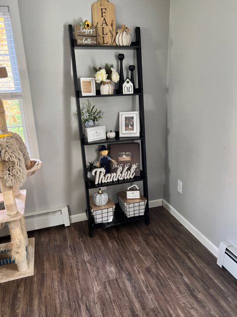 #laddershelf #livingroomdecor #fall #thankful #thanksgiving #sherwinwilliamlightgrenchgray #lightfrenchgray #liquidlumberdator #flooring #vinylplankflooring #rusticreclaimedoak #tranquility Fall Decor Ladder Shelf, Ladder Shelf Decor Living Room, Ladder Shelf Altar, White Corner Ladder Shelf, Bookshelf Styling Living Room, Ladder Shelf Decor, Corner Ladder Shelf Lowe's, Cozy Cottage Living Room, Brown Ladder Shelf