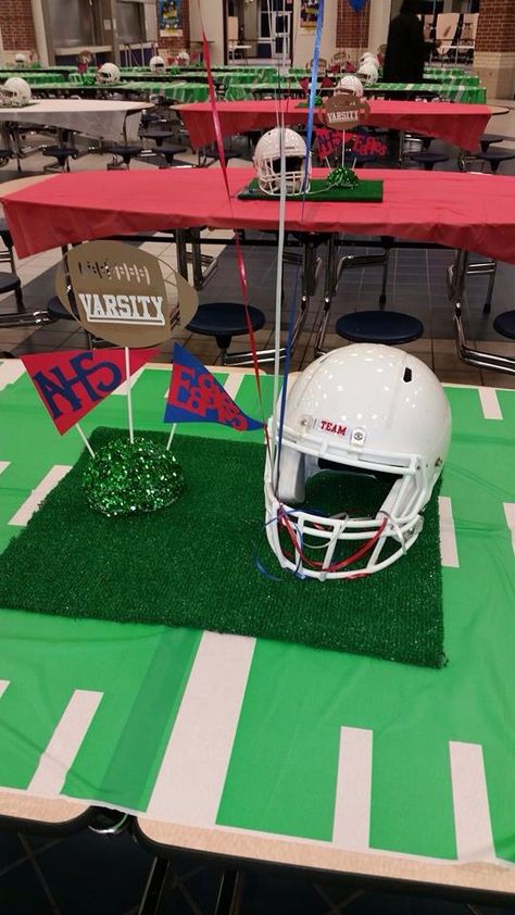 Football banquet centerpiece Football Helmet Centerpieces, Football Banquet Centerpieces Table Decorations, Helmet Centerpiece, Football Banquet Decorations, Football Banquet Centerpieces, Football Centerpiece, Kid Dinners, Football Centerpieces, Easy Dinners For Kids