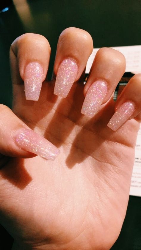 these pretty in pink glitter nails are so cute Grad Nails Acrylic Pink, Light Pink Nails With Gold Glitter, Light Pink Sparkly Nails Acrylic, All Pink Glitter Nails, Pink Sparkly Acrylic Nails Glitter, Light Glitter Pink Nails, Light Pink With Sparkles Nails, Glittery Light Pink Nails, Natural Pink Nails With Glitter