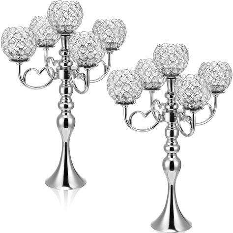 PRICES MAY VARY. Elegant and Luxurious Design: our 5 arm crystal candelabras come with hollow designs, crystal candle holder bowls are interspersed with the silver candlestick body, decorated with delicate heart shaped support arms for luxurious look, which can add brilliance and charm to your table and can easily grab your guests' attention Proper Size: the crystal candelabra centerpieces measure about 21.5 inches high overall, and each candle holder bowl is about 2.8 inches in opening diameter Wedding Anniversary Dinner Party, Anniversary Dinner Party, Wedding Anniversary Dinner, Bling Centerpiece, Candelabra Centerpieces, Tall Candle Holder, Silver Candelabra, Candelabra Centerpiece, Crystal Candelabra