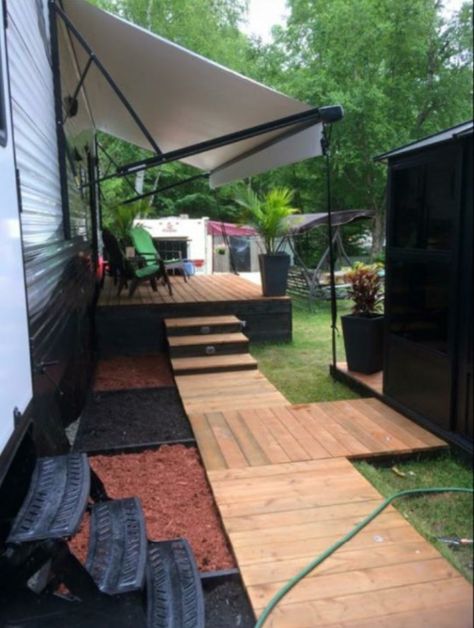 Rv site landscaping Seasonal Rv Lot Landscaping, Diy Camper Deck, Rv Sites Landscaping, Rv Outside Decorating Ideas Patio, Rv Site Decorating Ideas, Rv Permanent Site Ideas, Trailer Park Landscaping Ideas, Rv Landscaping Ideas, Rv Site Setup Ideas