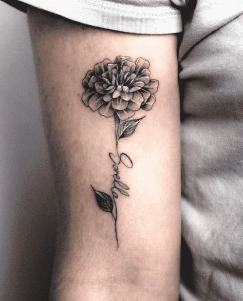 Marigold Tattoo With Name, Marigold With Name Tattoo, Marigold And Cosmos Tattoo Design, Marigold Daffodil Tattoo, Black Marigold Tattoo, Marigold Tattoo Design Black And White, Orange Marigold Tattoo, Marigold Butterfly Tattoo, Marigold Tattoo Black And White