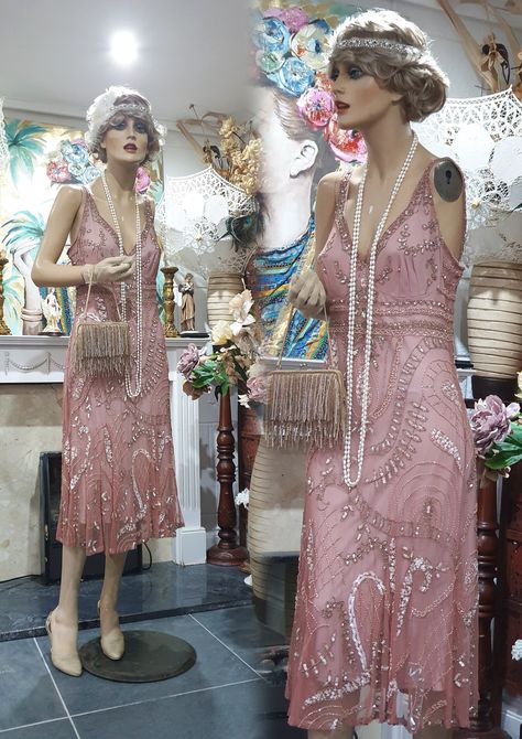 "Gorgeous 20's, 30's Downton Abbey style dress heavily embellished with golden bronze glass beads and sequins on a beautiful dusty pink net sheer. Luxurious and opulent this dress has an amazing Art Deco pattern front and back, a gathered flattering skirt lined with dusty pink polyester fabric. In very good condition.  Please, check the measurements below: Length: 47\"/ 120 cm Bust: 36\"/ 92 cm Waist: 36\"/ 92 cm Hips: 40\"/ 102 cm Note: Any display/ accessory items are not included in this transaction" Pink Flapper Dress Roaring 20s, Vintage Dresses 20s, Pink Flapper Dress, 1920s Fancy Dress, 1920s Clothes, 1920s Day Dress, Downton Abbey Style, 20s Dress, Pink Wigs