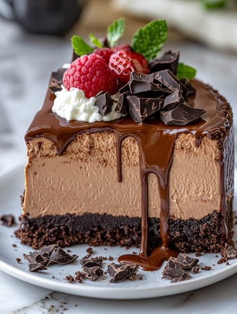 Triple Chocolate Mousse Cheesecake 🍬  🍬  Ingredients 🍬 For the crust: 1/4 cup unsalted butter, melted 🧈 2 cups Oreo crumbs 🍪 For the cheesecake: 1 cup semi-sweet chocolate chips, melted 🍫 1 cup sour cream 🥄 24 oz (680g) cream cheese, softened 🧀 1 teaspoon vanilla extract 🍦 1 cup granulated sugar 🍬 2 tablespoons cocoa powder 🍫 3 large eggs 🥚 For the chocolate mousse: 1/4 cup powdered sugar 1 1/2 cups semi-sweet chocolate chips 2 cups heavy cream, divided 🥛 1 teaspoon vanilla extract 🍦 Triple Chocolate Mousse, Chocolate Mousse Cheesecake, Mousse Cheesecake, Cheesecake Ingredients, Best Chocolate Desserts, Chocolate Egg, Chocolate Chip Cheesecake, Easy Cheesecake Recipes, Chocolate Cheese