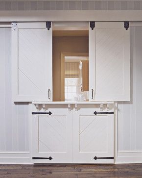 HDA Project 907 - traditional - hall     Very interesting! Sliding "barn door/dutch door" with storage underneath! Home Gym Storage Ideas, Sliding Door Room Dividers, Nyc Interior Design, Barn Door Closet, Harrison Design, Sliding Door Design, Room Divider Doors, Affordable Interior Design, Dutch Door