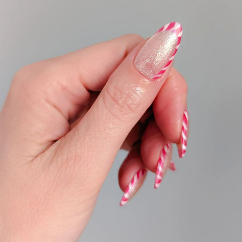 Sweet and a little twisted. 😉 @emmab_opinailboss creates this candy cane nail art using some naughty ‘n nice shades from the #OPITerriblyNice collection. Shades: Salty Sweet Nothings 🍡 Blame the Mistletoe 💋 Alpine Snow ❄️ #OPI #OPIObsessed #HolidayNails #candycanenails Candy Cane Nail Art, Candy Cane Nail, Candy Cane Nails, Blush Nails, Sweet Nothings, Sweet And Salty, Holiday Nails, Winter Nails, Candy Cane